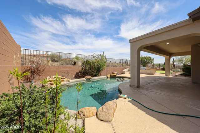 an aerial view of residential house with an outdoor space