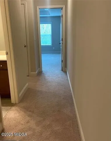 a view of a hallway with closet