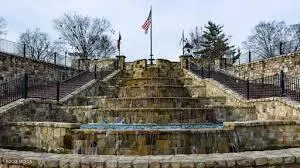 a table and chairs under an umbrella