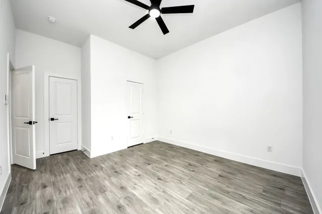 a view of a room with wooden floor
