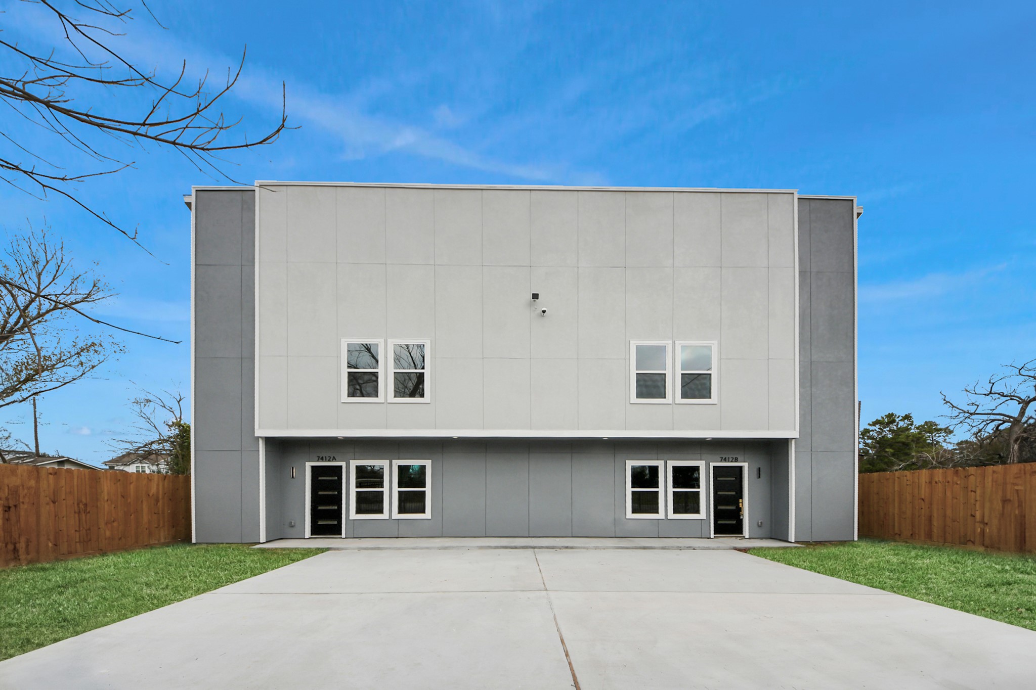 7412 Carver Road, Unit B Houston, TX 77088 - Photo 22 of 22 a front view of a house with a yard and garage