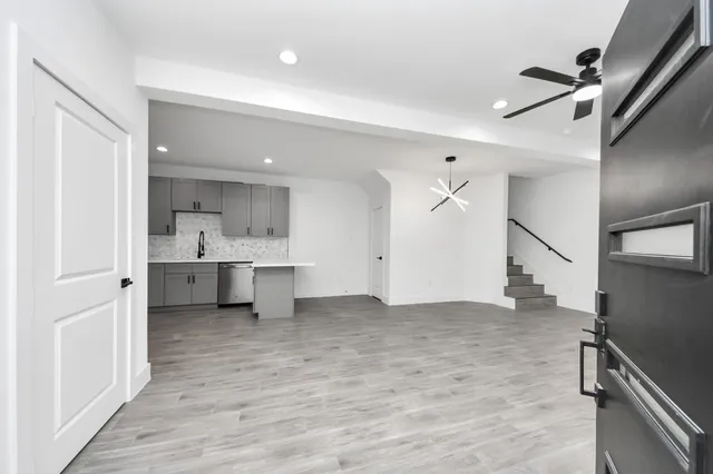 a view of a kitchen with a sink and a window