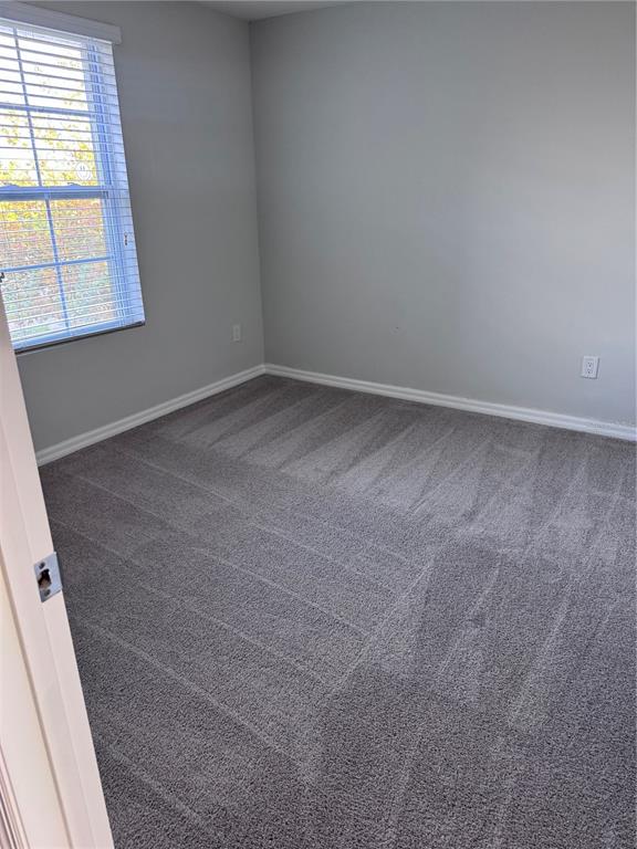 1613 Reflection Cove St. Cloud, FL 34771 - Photo 9 of 10 an empty room with a window