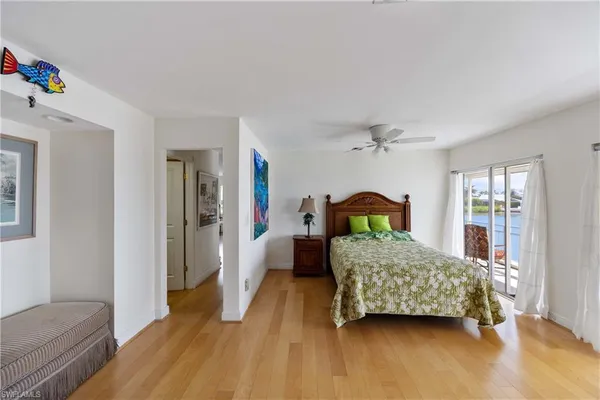 a bedroom with a bed closet and window