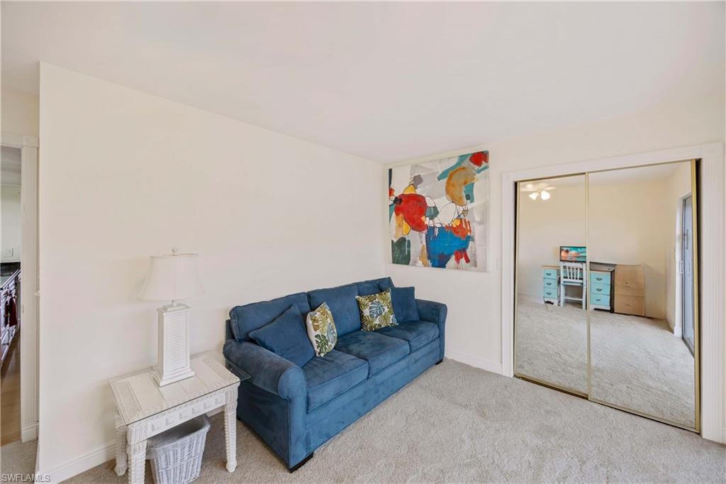 330 Kon Tiki Drive, Unit A2 Naples, FL 34113 - Photo 23 of 39 a living room with furniture and a couch