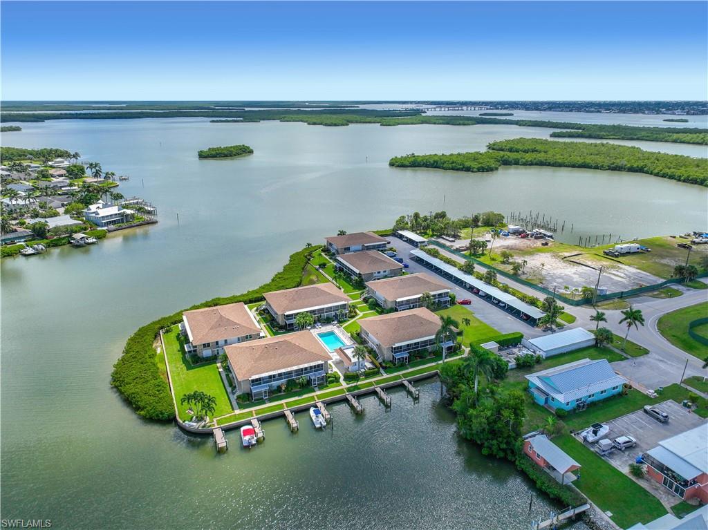 330 Kon Tiki Drive, Unit A2 Naples, FL 34113 - Photo 27 of 39 a room with toys and wooden floor