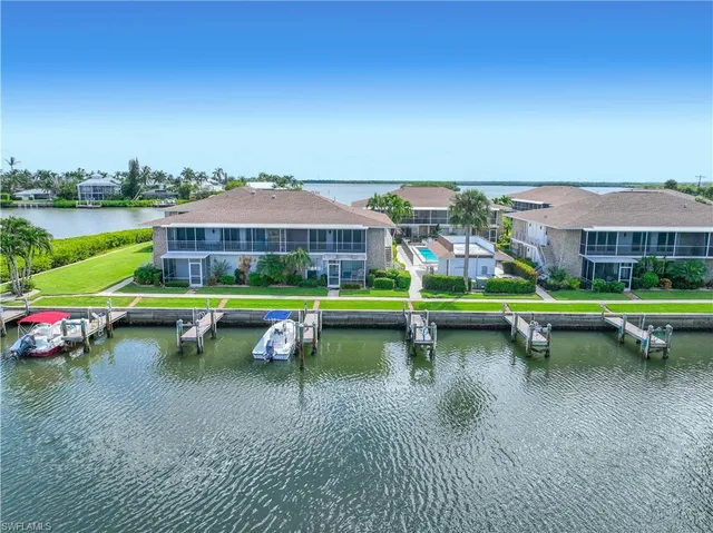 a view of swimming pool with outdoor seating space