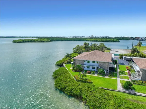 a view of a lake with a big yard