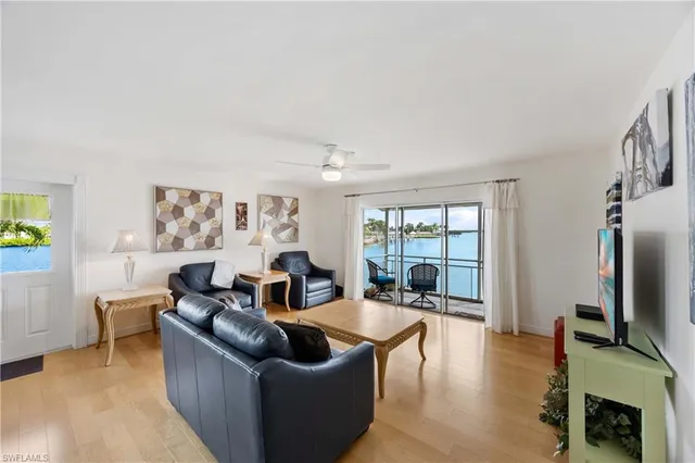 a living room with fireplace furniture and a flat screen tv