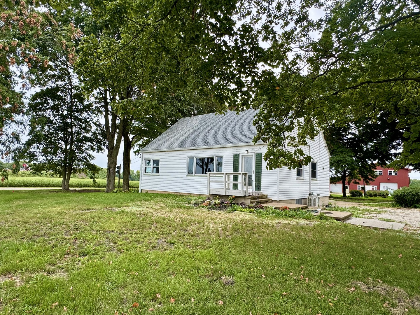 6809 Highway 71 Oswego, IL 60543 - Photo 2 of 20 a front view of a house with garden