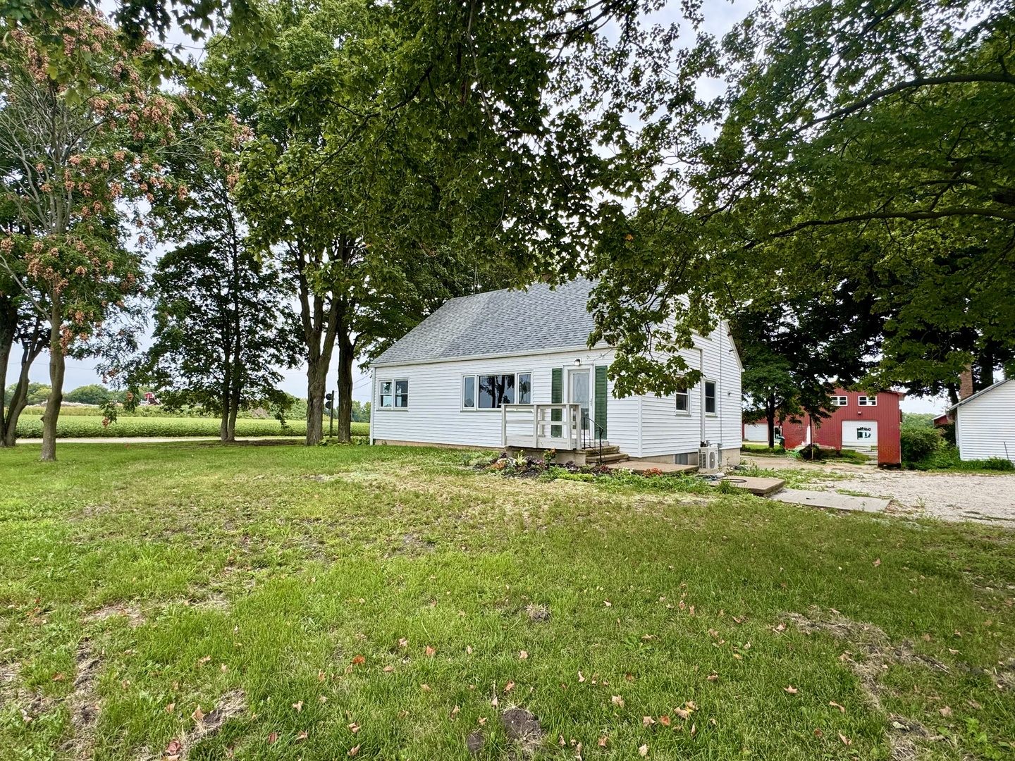6809 Highway 71 Oswego, IL 60543 - Photo 3 of 20 a front view of a house with a garden