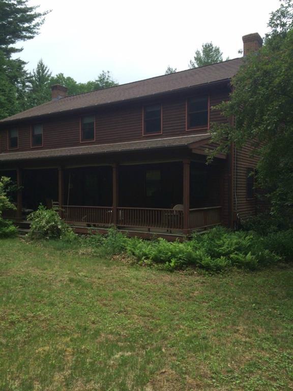 149 Ridge Road Chaplin, CT 06235 - Photo 1 of 1 a view of house with backyard space and garden
