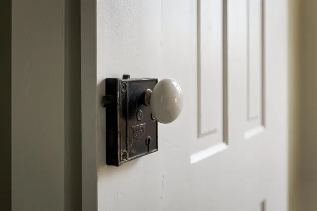 a bedroom with a bed and a walk in closet