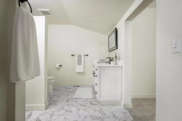 a bathroom with a sink vanity and a mirror
