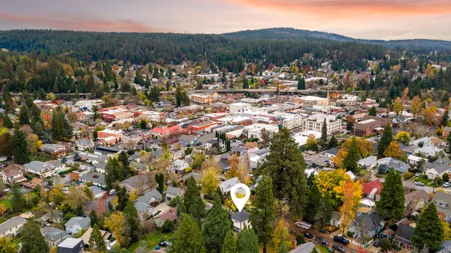 a view of a city with mountains in the background