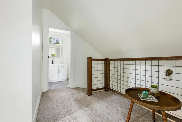 a bathroom with a sink toilet and mirror