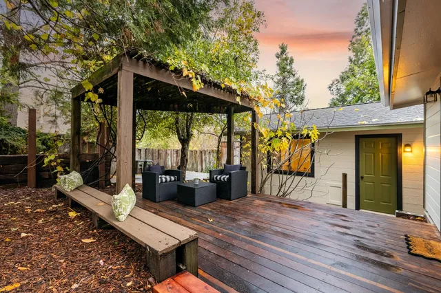 a living room with furniture a window and wooden floor