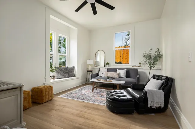 a living room with furniture and a large window