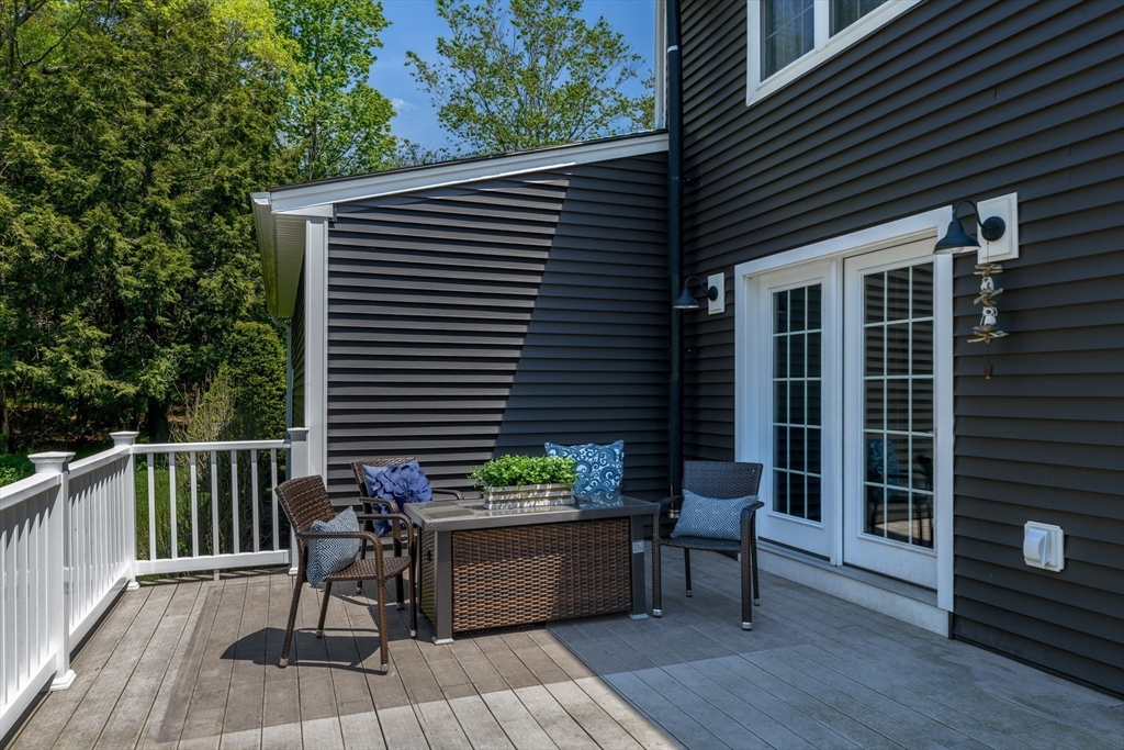 27 Vista Circle Rutland, MA 01543 - Photo 29 of 35 a balcony with furniture and wooden floor