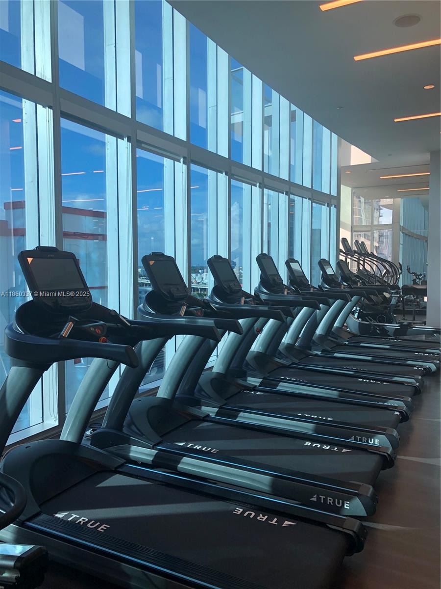 851 Northeast 1st Avenue, Unit 3904 Miami, FL 33132 - Photo 17 of 28 a living room with furniture