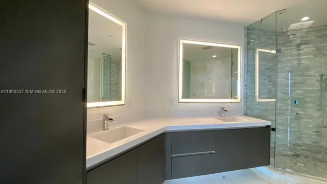 a bathroom with a bathtub and a sink