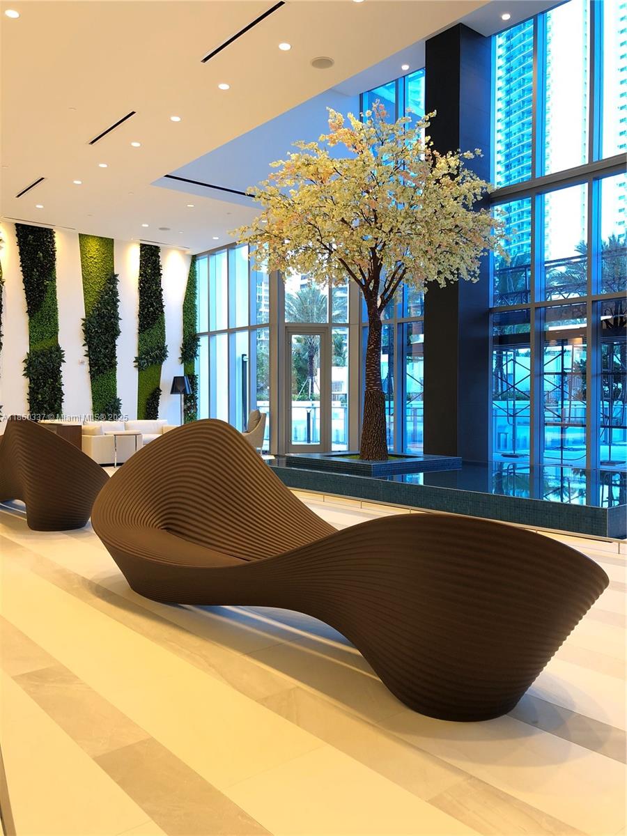 851 Northeast 1st Avenue, Unit 3904 Miami, FL 33132 - Photo 3 of 28 a view of a living room and chandelier