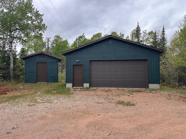 2377 Finn Road Babbitt, MN 55706 - Photo 29 of 32 Detached garage featuring a shed
