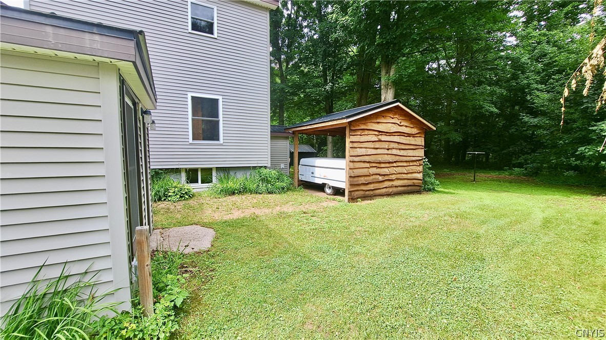 6550 River Road Watson, NY 13367 - Photo 39 of 48 Covered storage area with cement pad and power