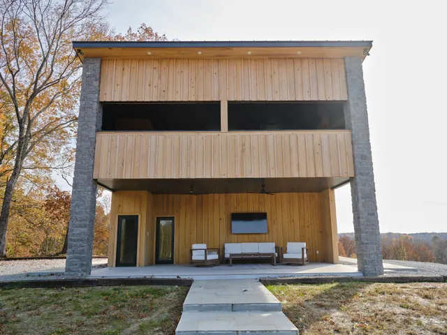 a view of a house with backyard of snow