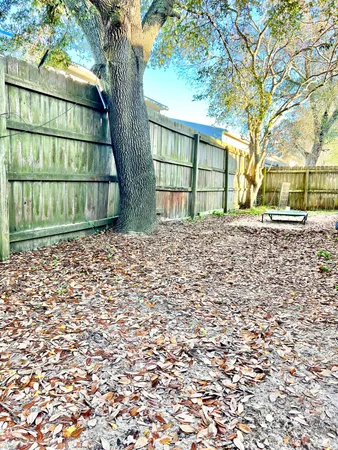 a house with a trees in front of it