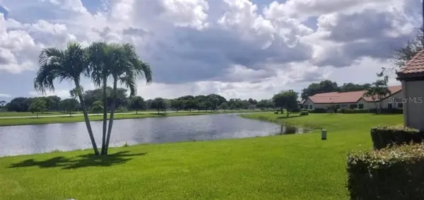 a view of a lake with a yard