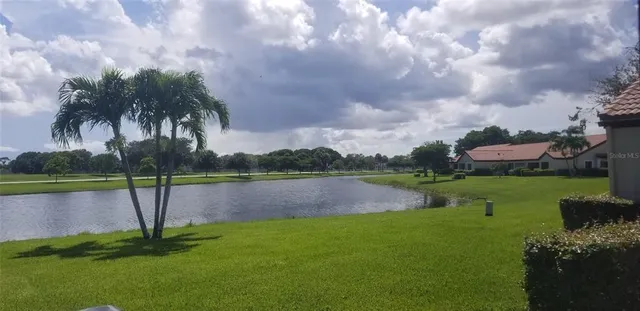 a view of a lake with a yard