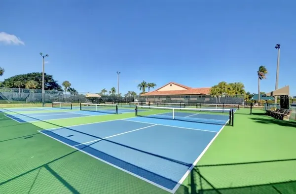 a view of an outdoor space and tennis court