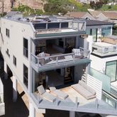 a balcony with furniture and a fireplace