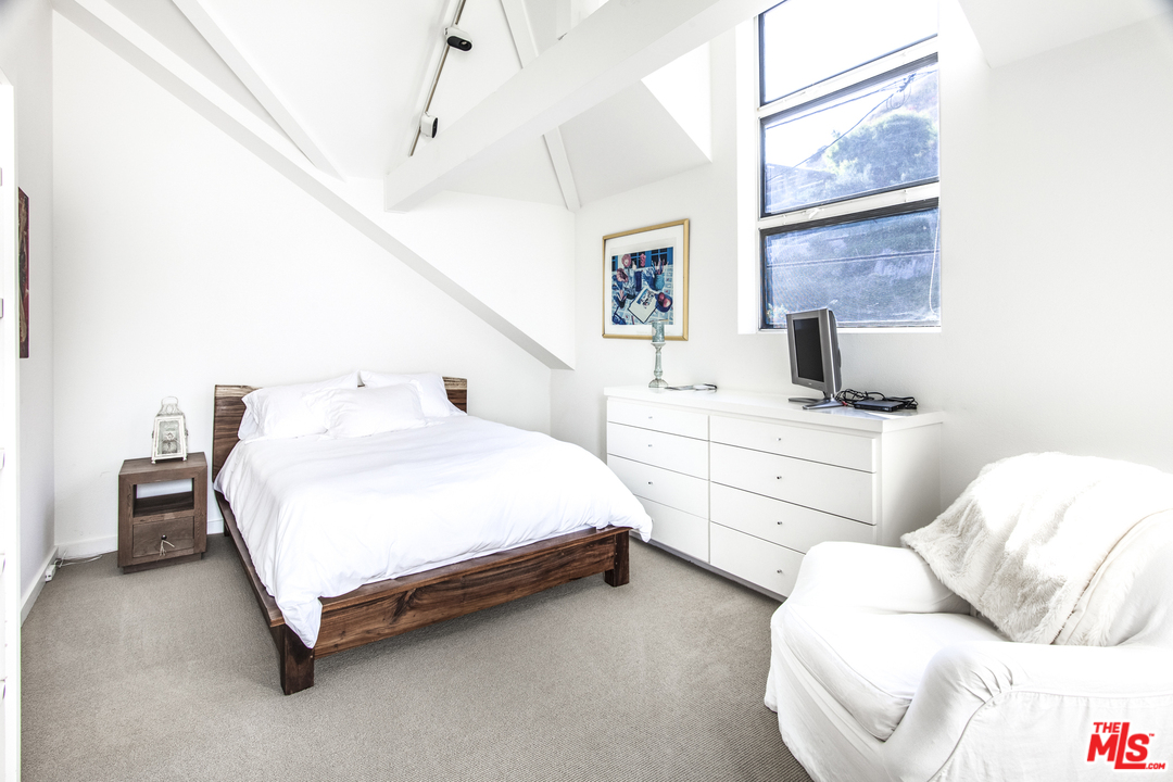 23952 Malibu Road Malibu, CA 90265 - Photo 16 of 23 a bed room with a bed and a window