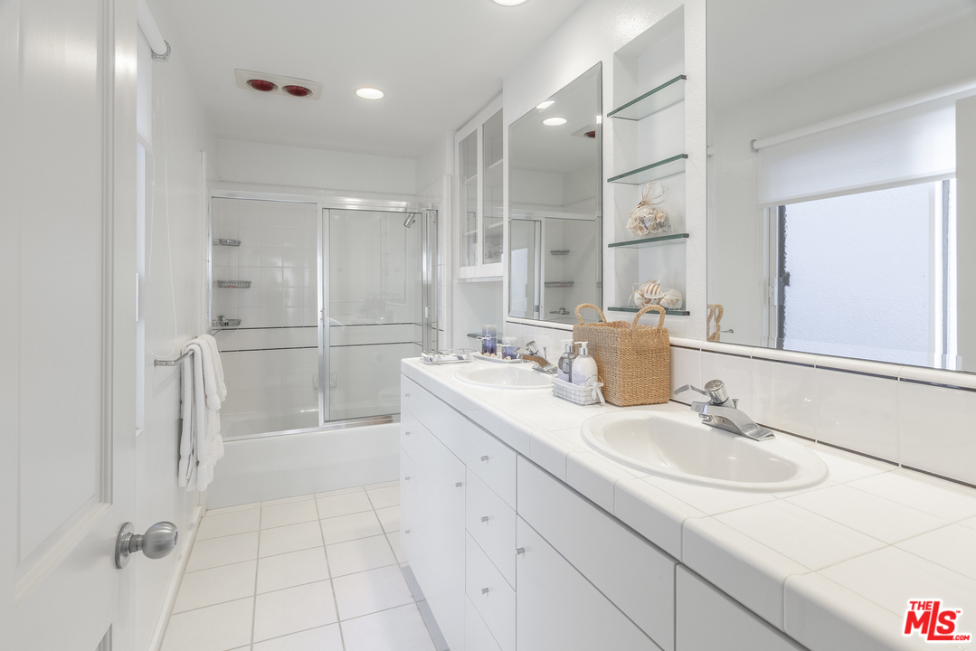 23952 Malibu Road Malibu, CA 90265 - Photo 17 of 23 a bathroom with a sink and a mirror