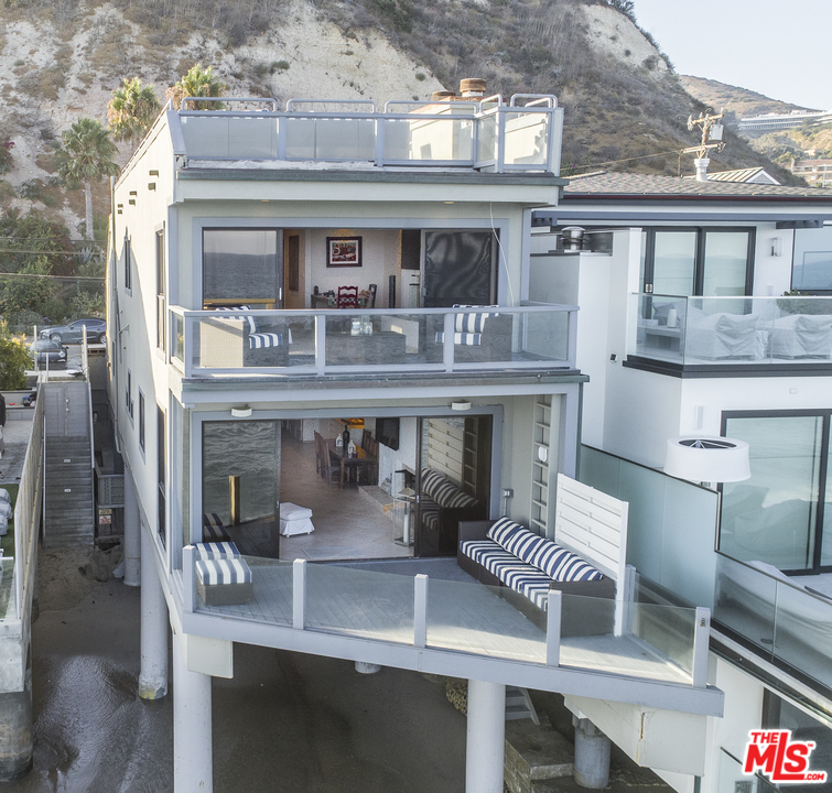 23952 Malibu Road Malibu, CA 90265 - Photo 3 of 23 a view of living room with furniture and chandelier