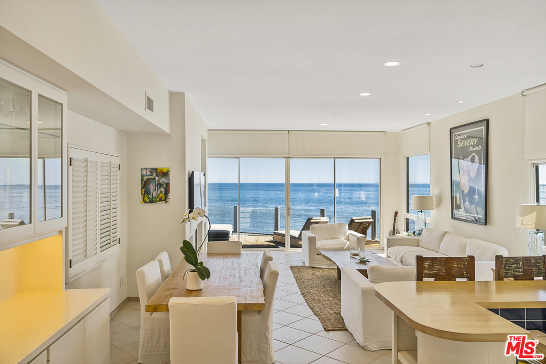 23952 Malibu Road Malibu, CA 90265 - Photo 7 of 23 a living room with furniture and large windows