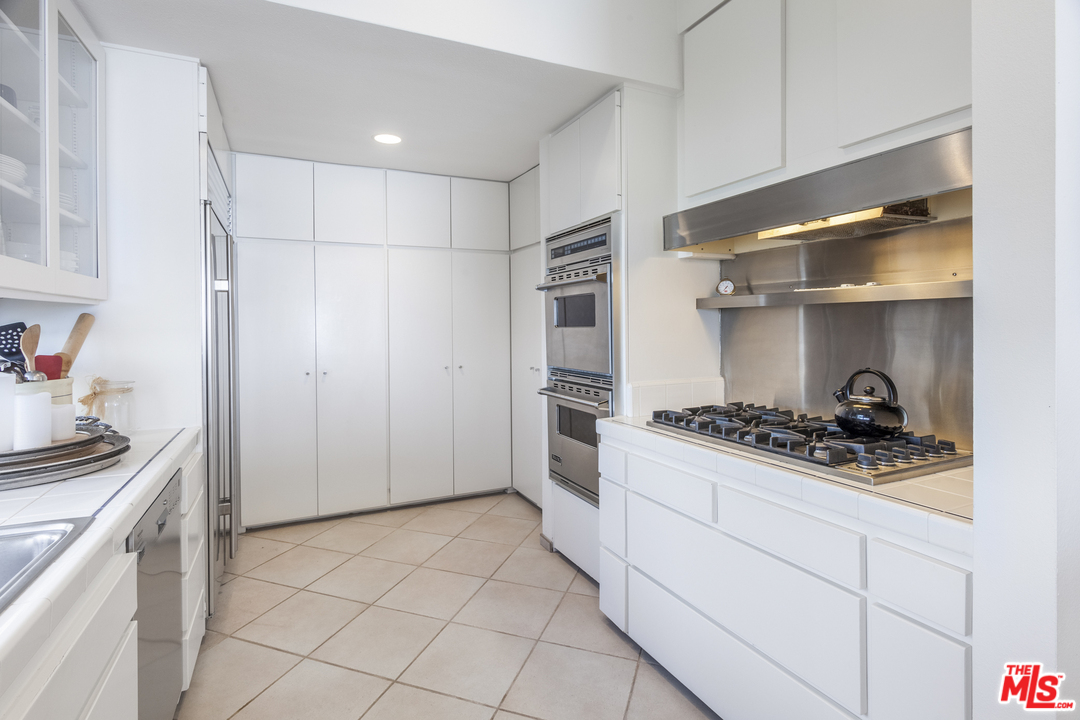 23952 Malibu Road Malibu, CA 90265 - Photo 9 of 23 a kitchen with stainless steel appliances a refrigerator and a stove