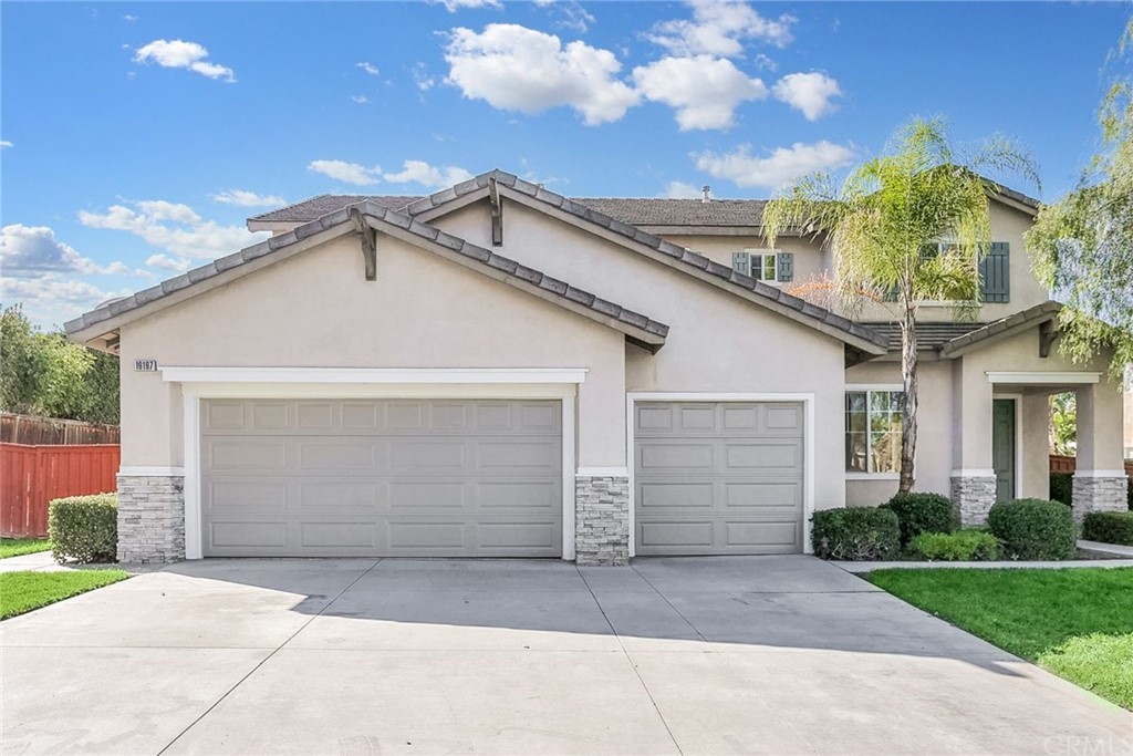19197 Buckboard Lane Riverside, CA 92508 - Photo 1 of 1 a front view of a house with a yard and garage