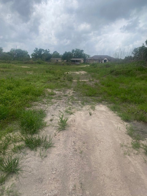 0 Cr 383 Rosharon Tx 77583 Rosharon, TX 77583 - Photo 20 of 44 a view of a lake with houses in the back