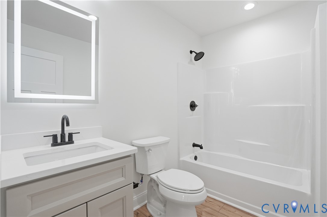 7839 King William Road Aylett, VA 23009 - Photo 23 of 38 a bathroom with a sink a toilet and a bathtub