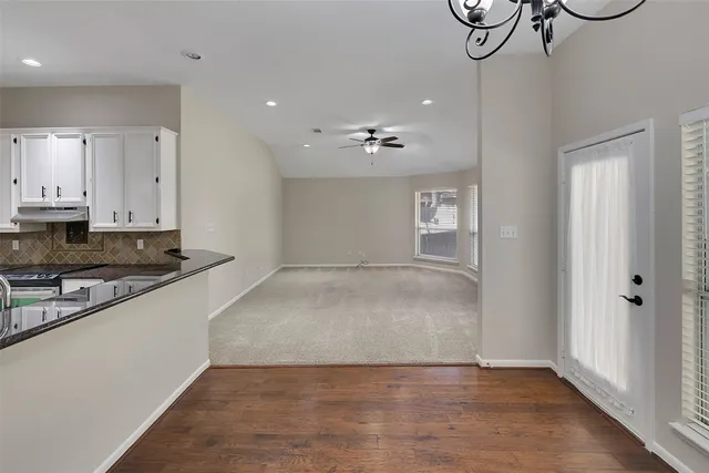 a view of a kitchen with a sink cabinets and a window