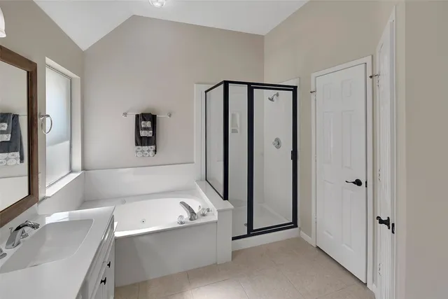 a bathroom with a bathtub and a sink