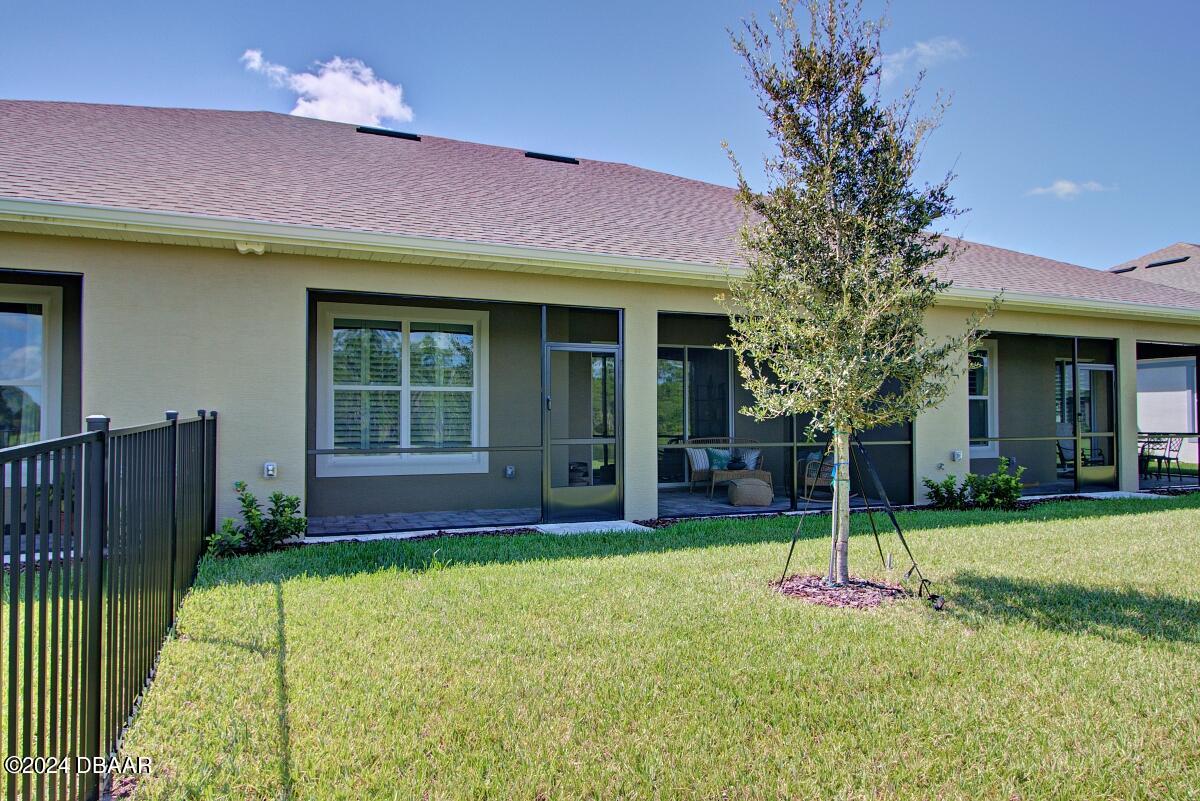 8 Finch Walk Road Ormond Beach, FL 32174 - Photo 18 of 18 a view of a house with a yard and porch