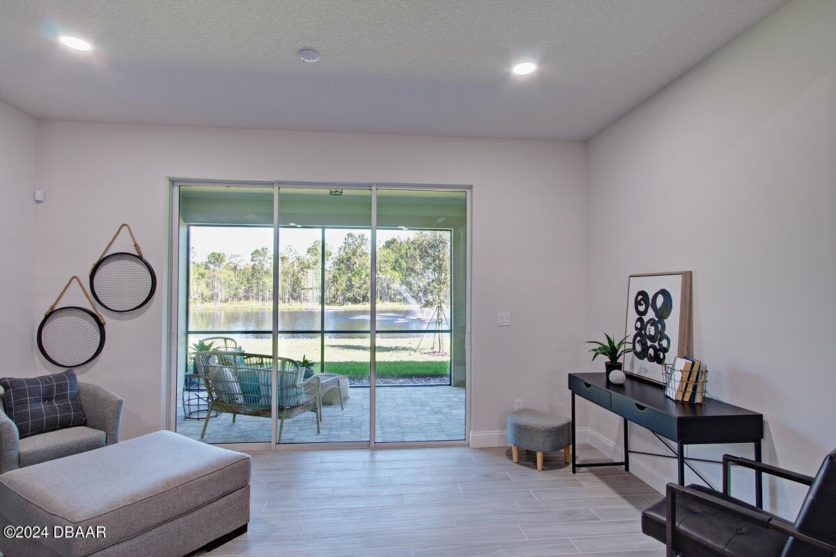 8 Finch Walk Road Ormond Beach, FL 32174 - Photo 8 of 18 a living room with furniture and a window