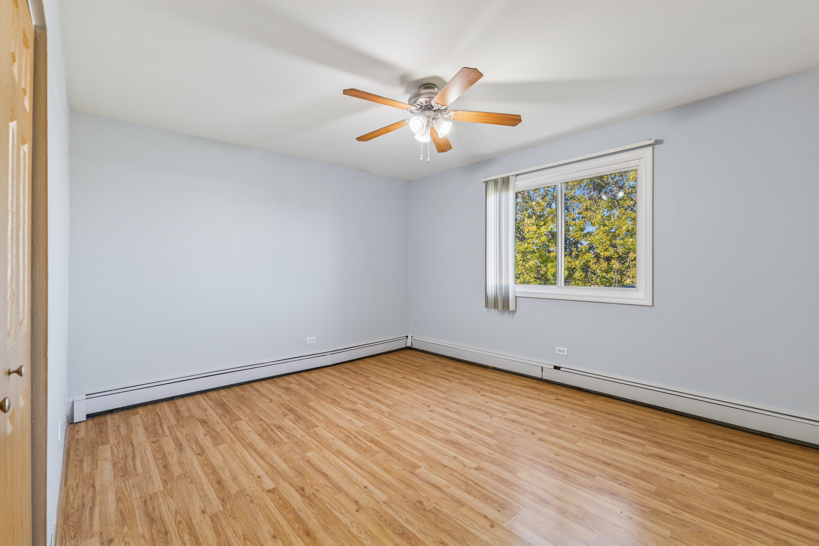 17220 71st Avenue, Unit 11 Tinley Park, IL 60477 - Photo 13 of 20 wooden floor in an empty room with a window
