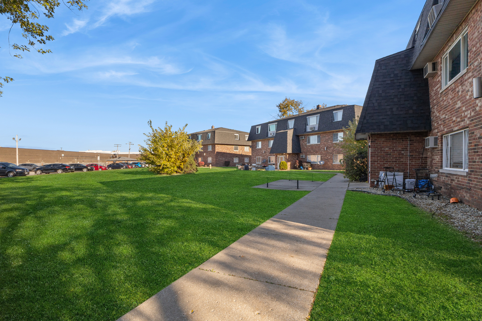 17220 71st Avenue, Unit 11 Tinley Park, IL 60477 - Photo 5 of 20 a view of a street with a building in the background