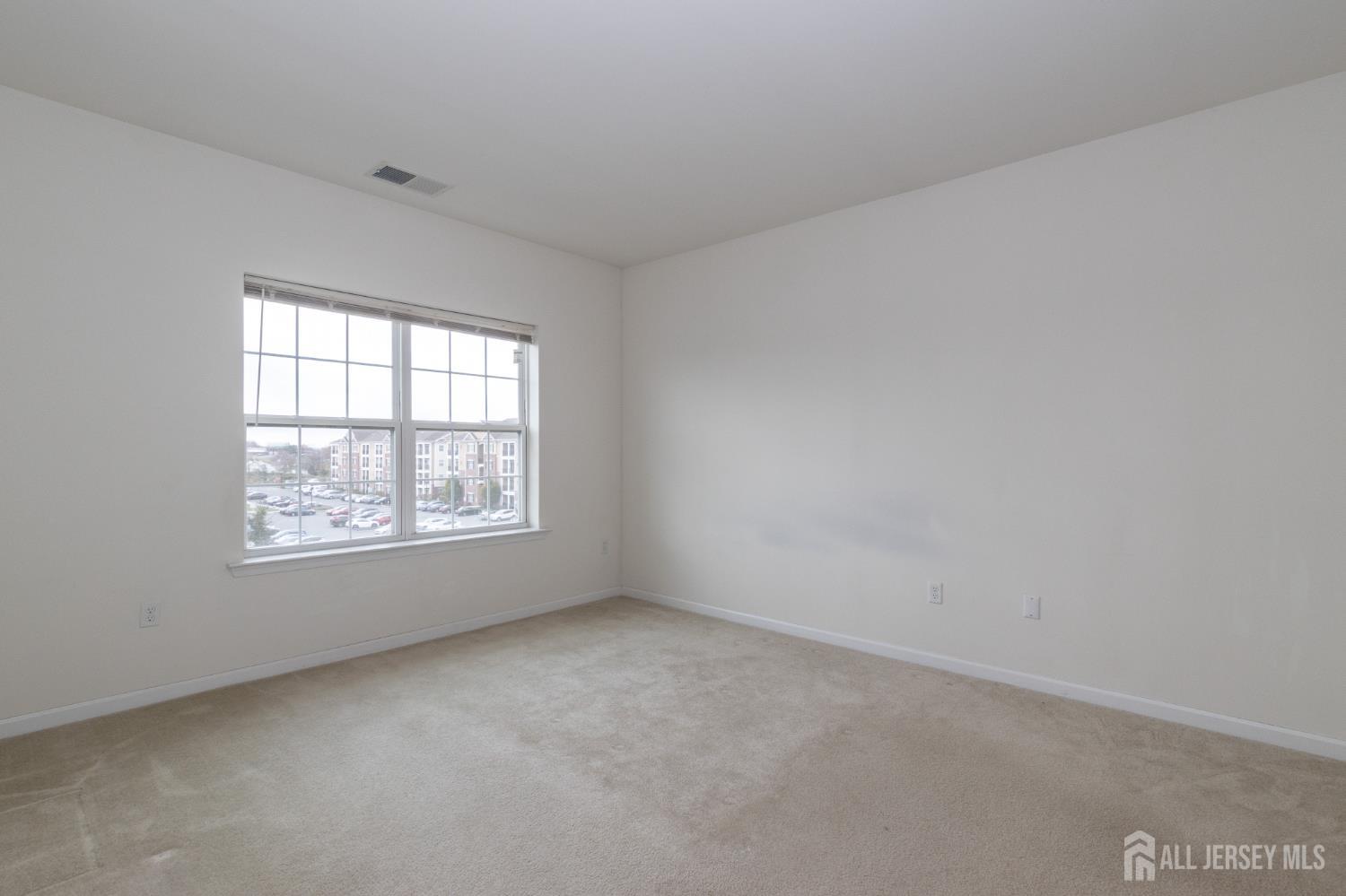 541 East Celebration Way South Plainfield, NJ 07080 - Photo 21 of 35 an empty room with windows