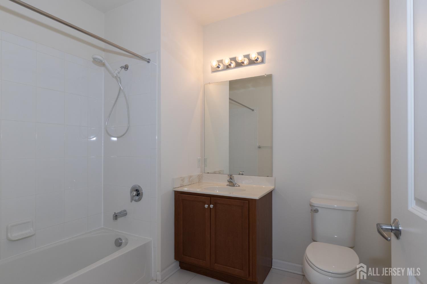 541 East Celebration Way South Plainfield, NJ 07080 - Photo 22 of 35 a bathroom with a sink a toilet and shower